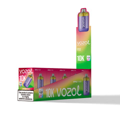 Vozol 10K disposable vape device packaging and a single device shown on a clean white background. The packaging features a vibrant green-to-pink gradient with the Vozol brand name and '10K' text, alongside an Apple Cider flavor label and a nicotine warning.